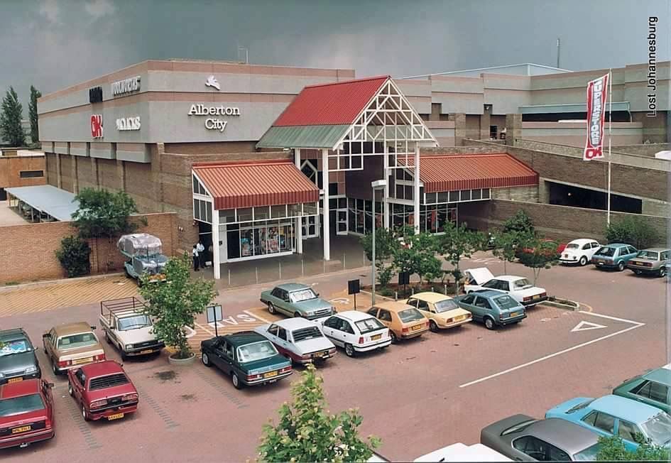 Alberton City Shopping Centre entrance with parked cars, showcasing the commercial hub in Alberton.