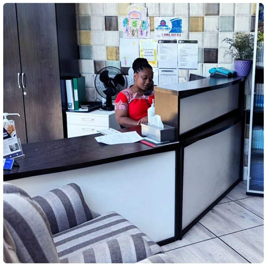 Friendly staff member at the reception desk of MyRehab's drug and alcohol rehab centre in Johannesburg